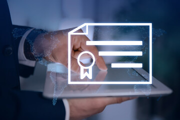 Online learning concept. Diploma icon with world map illustration on foreground and man using tablet, closeup