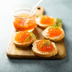 Red caviar on toast with dill