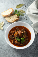 Traditional homemade beef goulash with fresh parsley