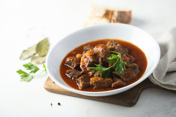 Traditional homemade beef goulash with fresh parsley