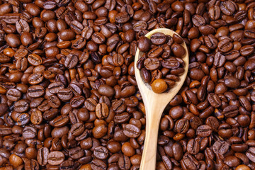 roasted coffee beans background texture top view.
