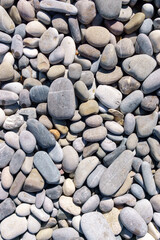 sea pebbles, natural background, texture. Sea background and beach. vertical photo