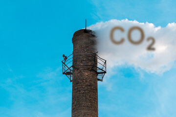 Smoke of chimney writing CO2 in the sky