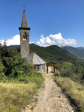 Italian Francigena trail path and church in Tuscany Cisa mountain pass 