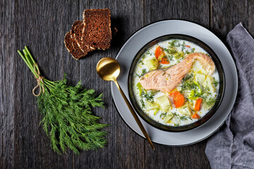 salmon fish soup with cream and veggies, top view