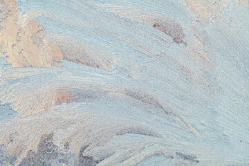 Abstract ice and frost patterns on glass window