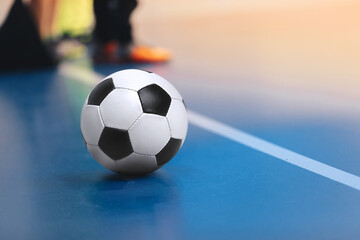 Indoor soccer sports hall. Football futsal ball, futsal floor nad players on training. Sports...