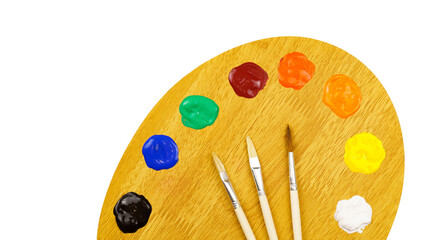 Art palette with paints and brushes isolated on white background