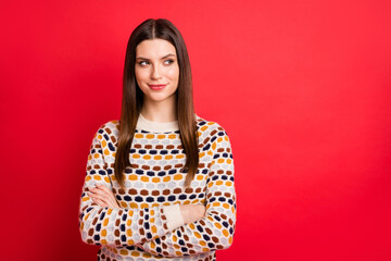 Photo portrait of curious girl looking empty space crossed hands isolated bright red color background