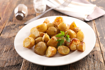 plate with fried potato and herb
