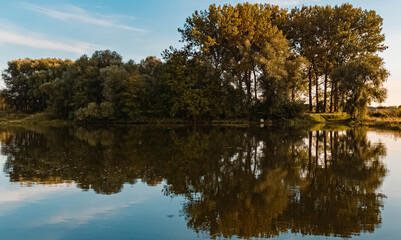Fototapeta na wymiar Beautiful summer view with reflections near Mettenufer, Danube, Bavaria, Germany