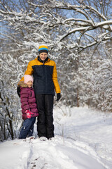 Fototapeta na wymiar Two children on a walk in winter