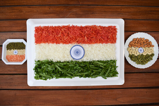 Indian republic day theme Indian flag depicted by food. Salad of fresh raw grated carrot, radish and spinach