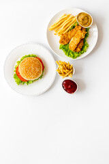 Overhead view of fast food - burger and french fries, flat lay