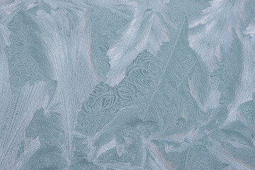severe frost froze water on the window and painted patterns on it