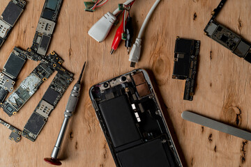 Closeup of smartphone ready to repair. A close up picture of isolated mobile phone getting ready to...