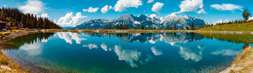 Fototapeta na wymiar High resolution stitched panorama of a beautiful alpine summer view with reflections in a lake at the famous Astberg summit, Going, Wilder Kaiser, Tyrol, Austria