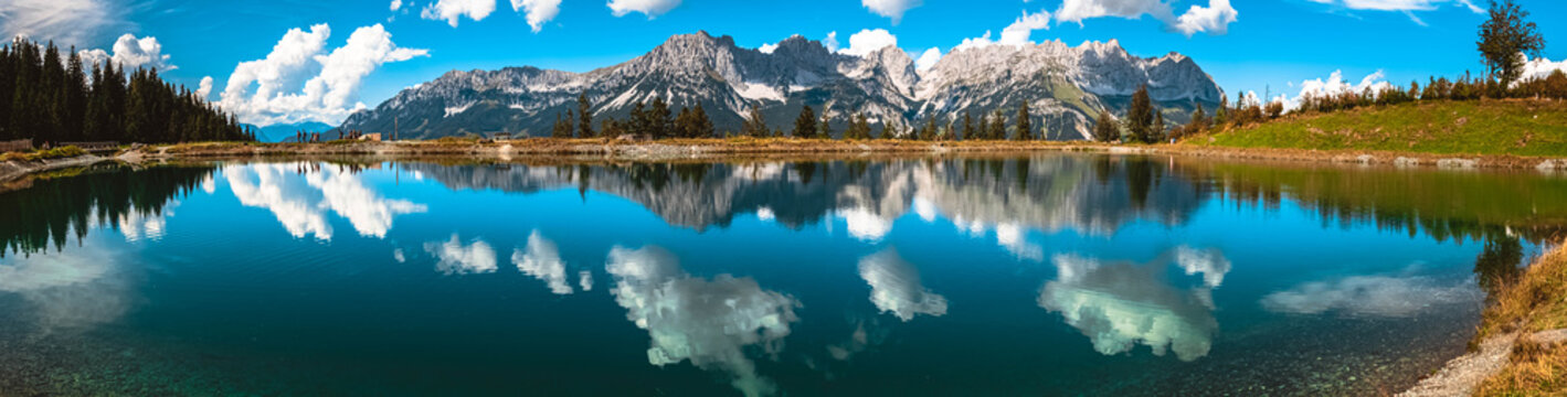 High resolution stitched panorama of a beautiful alpine summer view with reflections in a lake at the famous Astberg summit, Going, Wilder Kaiser, Tyrol, Austria