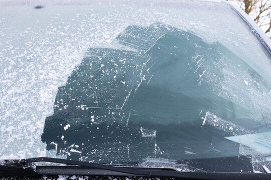 car window half cleared of ice