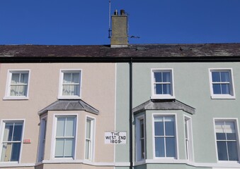 Fototapeta na wymiar A pair of typical, historic terraced houses on a street in Beaumaris, Anglesey, Wales.