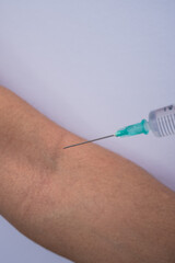 A doctor giving a Covid 19 vaccination to a girl (Close up)