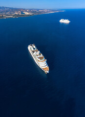 Aerial view of two cruise ships near the coast