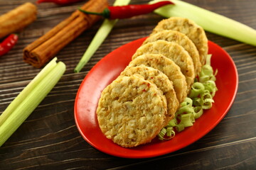 Fresh uncooked mutton cutlets ready for deep frying.
