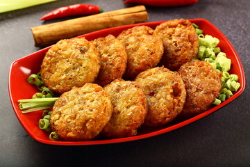 Oven fresh crispy baked meat  cutlets -Asian cuisines background.