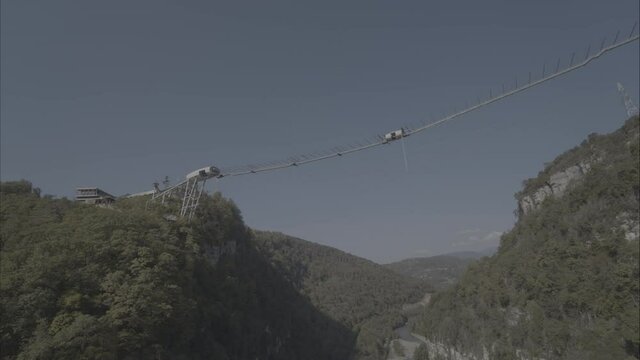 Sochi, Russia. Flying a drone from a height above the bridge Sochi Skypark