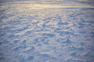 Snow texture. drawing created by the wind. cold nature
