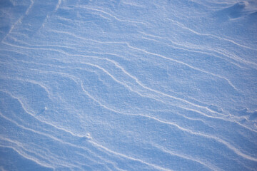 Snow texture. drawing created by the wind. cold nature