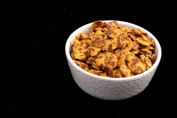 Real Taste Of Traditional India Hot Chana Jor Garam Chat Made From Beaten Chick Peas Bengal Daal And Pepper Spices In Served In White Bowl And Isolated On Black Background With Space For Custom Text