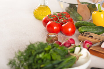 Ingredients for vegetable salad on kitchen table, top view