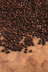 Coffee beans on wood background