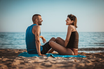 Fototapeta premium Beautiful young couple on sea vacation holiday, enjoying summer time at beach 