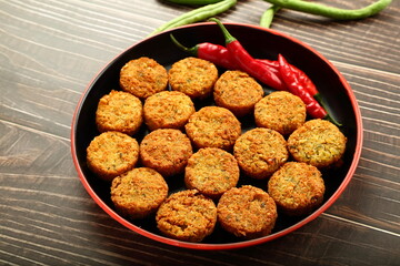 Healthy vegetarian cutlets in a cooking pan- healthy snack foods background.