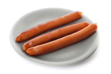 Three wiener sausages on a grey plate. Studio photo isolated on white background.