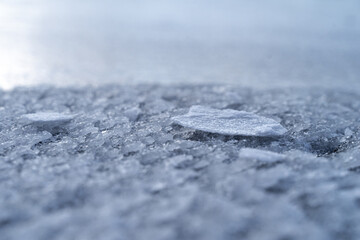 The icy texture on the frozen river. Crystal abstraction for the background. Macro ice surface shoot. 
