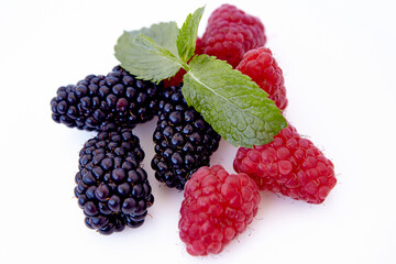 Raspberry and blackberry and mint isolated on white background. Vegan food, detox concept