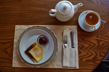 Pancakes With Honey And Tea. Tasting traditional Russian cuisine