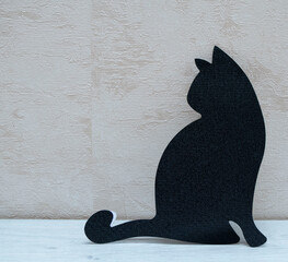 silhouette of a black cat on a light background. cat template