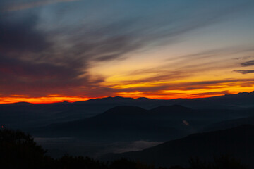 Scenic view of Mountains against sky during sunrise. Majestic sunrise over the mountains