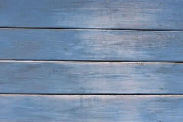 Obraz premium Old wooden background. Wood texture with a shabby blue paint.
