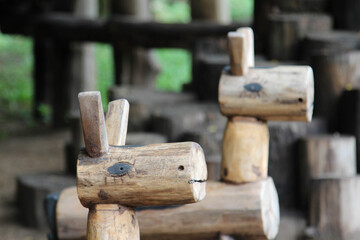 Wooden rocking horse on the ground.