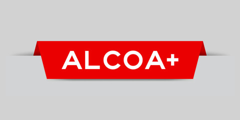 Red color inserted label with word aloca + on gray background