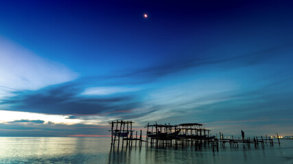 Fototapeta na wymiar Morning view before sunrise Fishing boat's harbor service at Bang Hoi Beach, Songlkhla, Thailand.