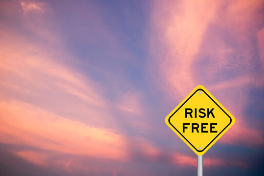 Yellow transportation sign with word risk free on violet sky background