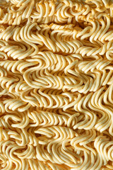 Texture of yellow instant noodles close up