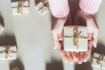 Gives a gift Christmas presents laid on a wooden table decoration background. Xmas concept.