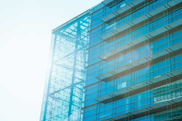 underside panoramic and perspective view to steel blue glass high rise building skyscrapers, business concept of successful industrial architecture